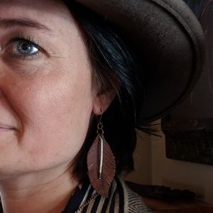 Leather feathers with porcupine quills.